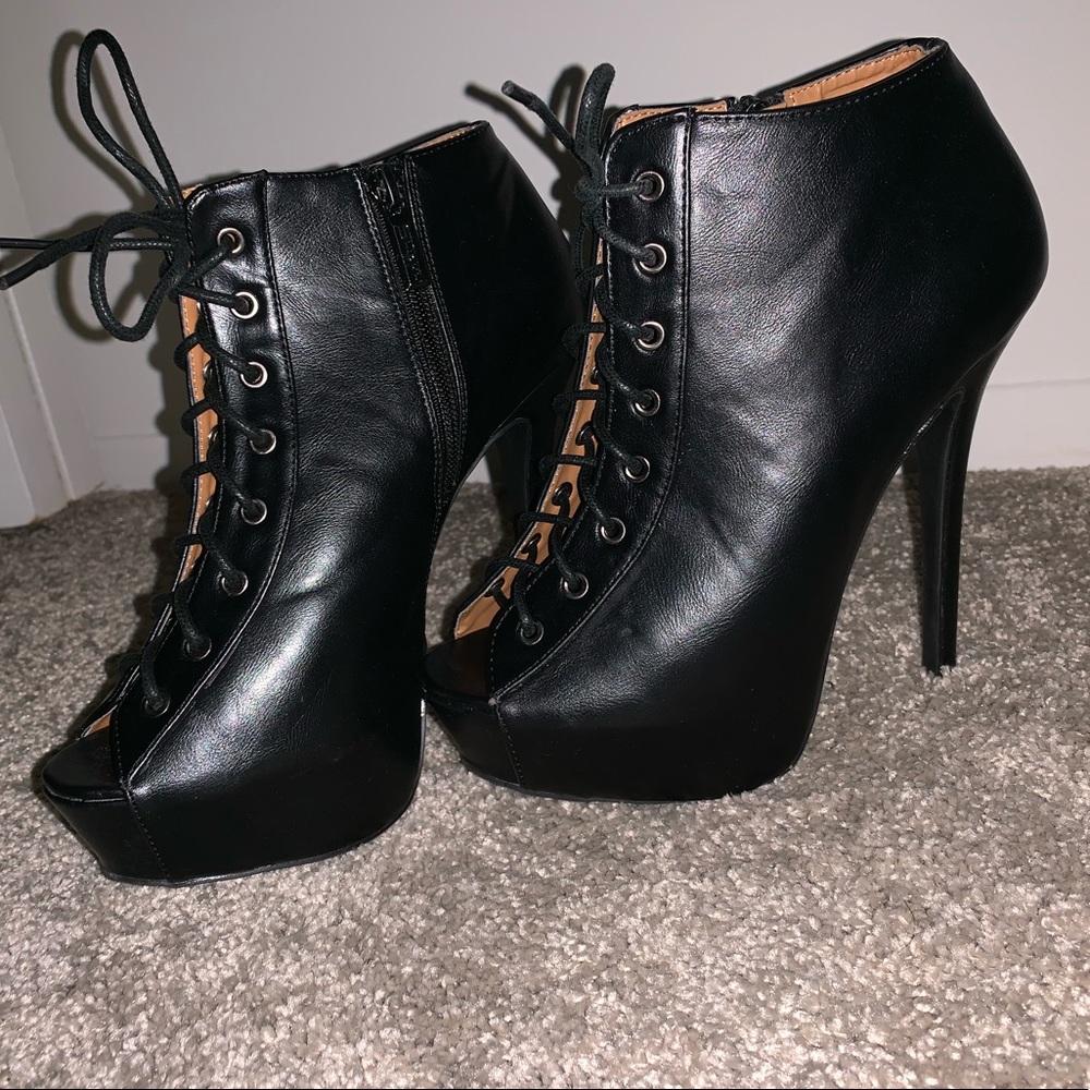 Worn once. Black Lace Up Shiekh Heel